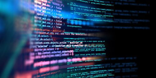 An abstract and colorful representation of programming code moving across the screen.